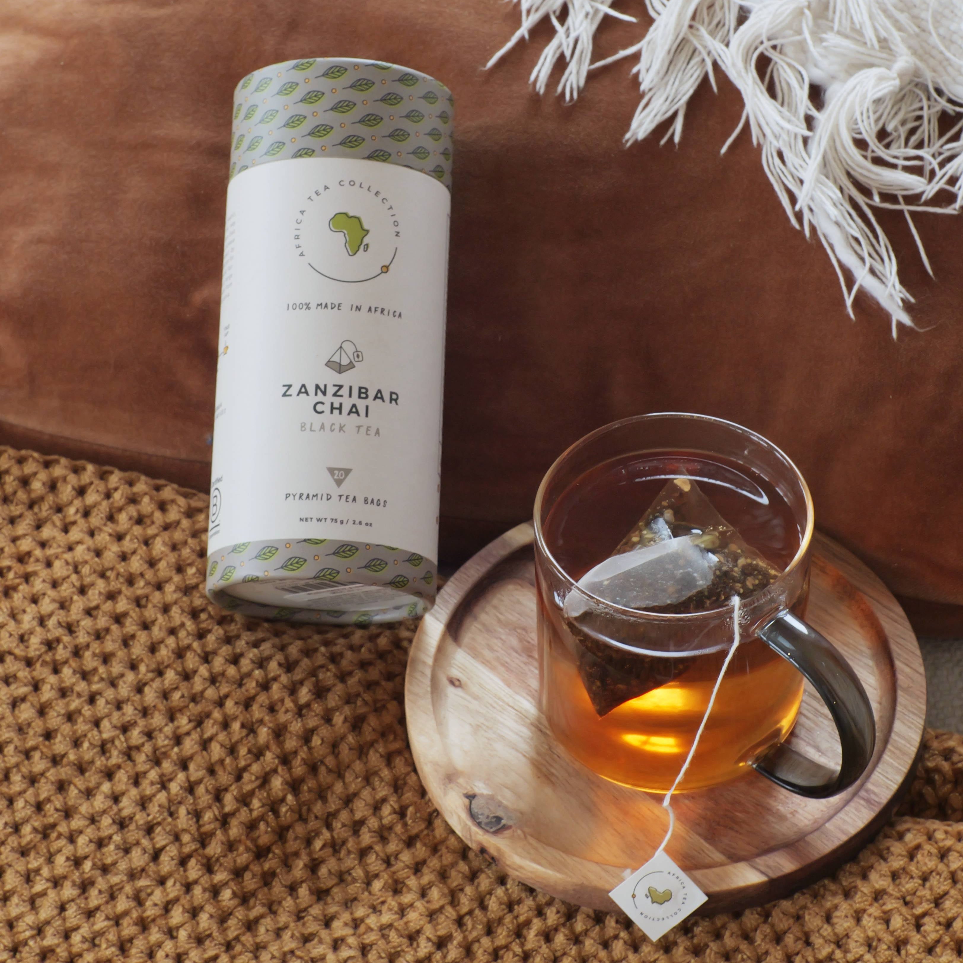 Zanzibar Chai tea blend and tea cup on a textured surface with a white blanket